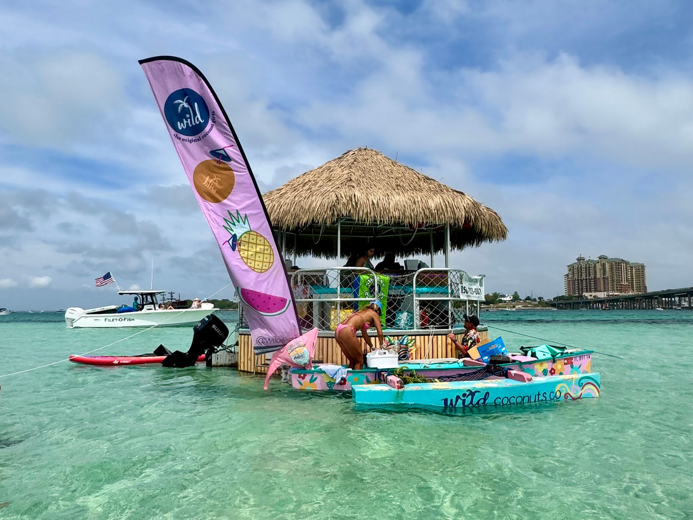 Private tiki boat charter decorated for a wedding at Baytowne Wharf